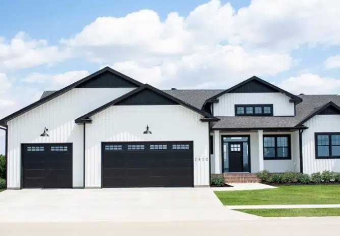 Elegant Black Garage Doors on White House
